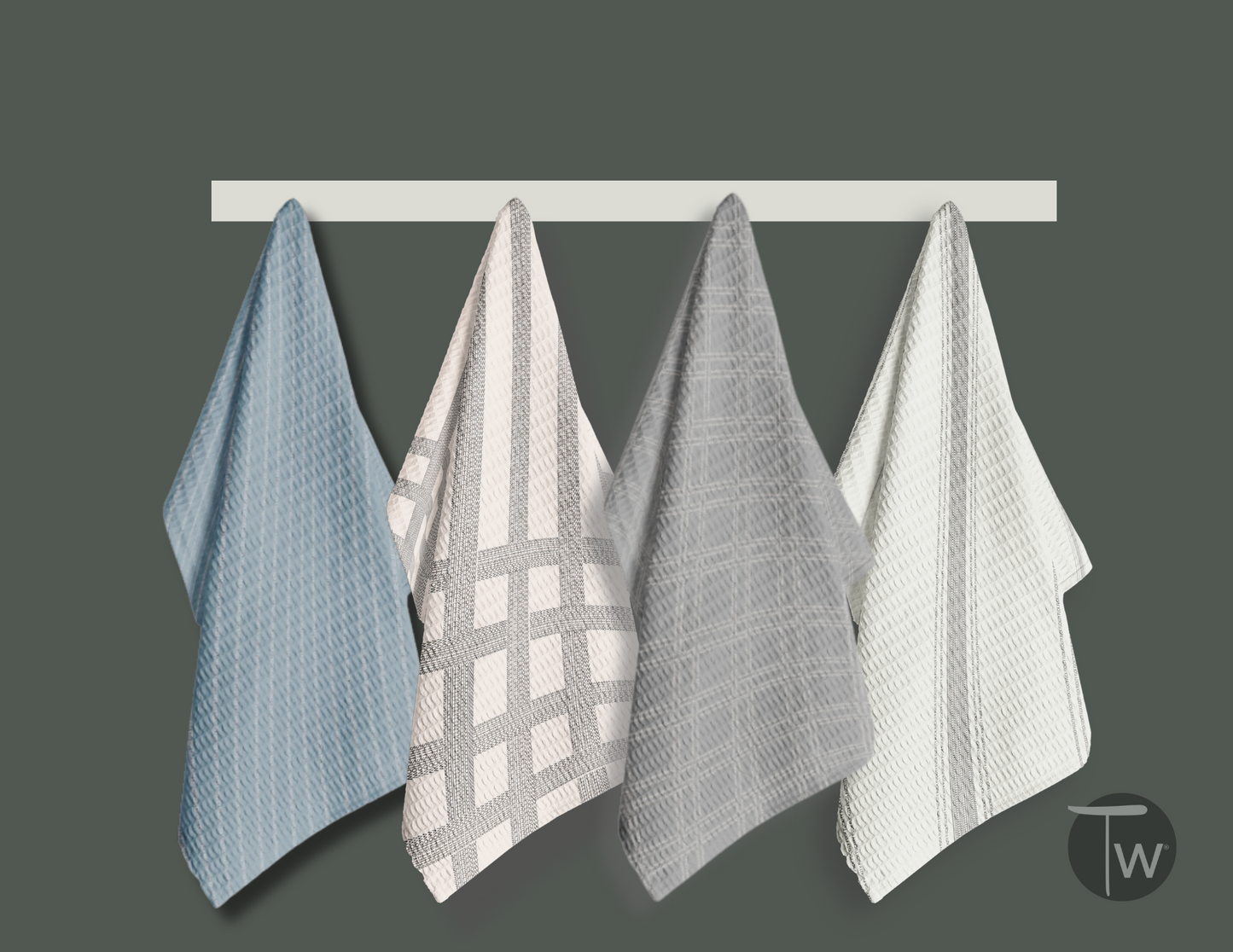 Colette Stripe Illusion towels in blue, pink, gray, and white hanging on a white rack against a dark background.