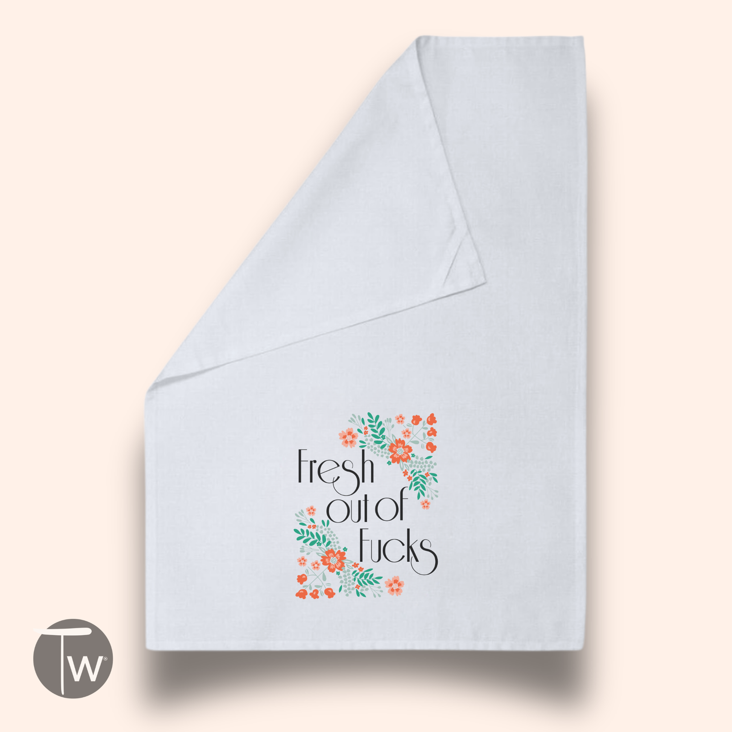 White cotton tea towel with the phrase "Fresh out of Fucks" surrounded by colorful floral designs.