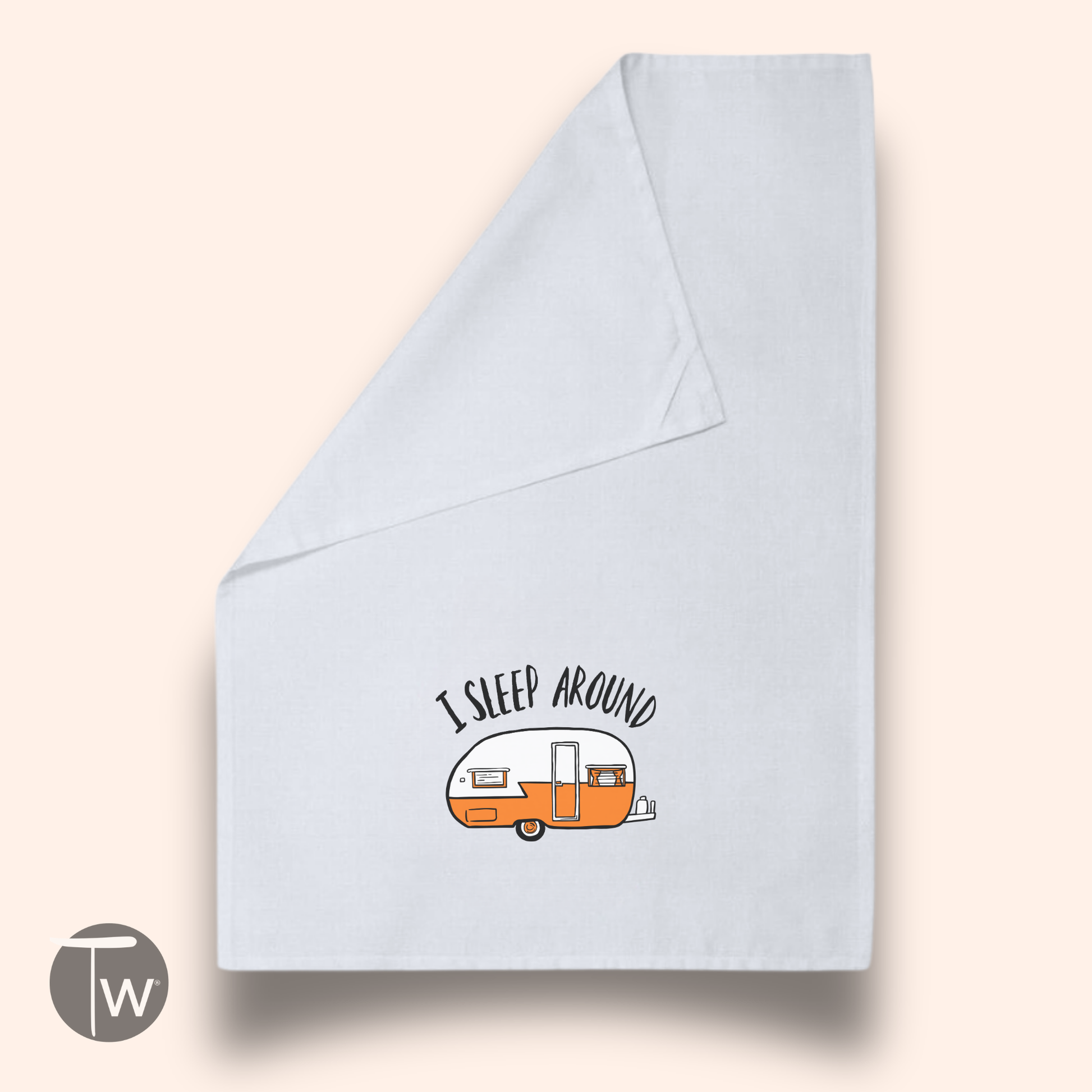White cotton tea towel featuring a humorous design with the text "I sleep around" and an illustration of a vintage camper.