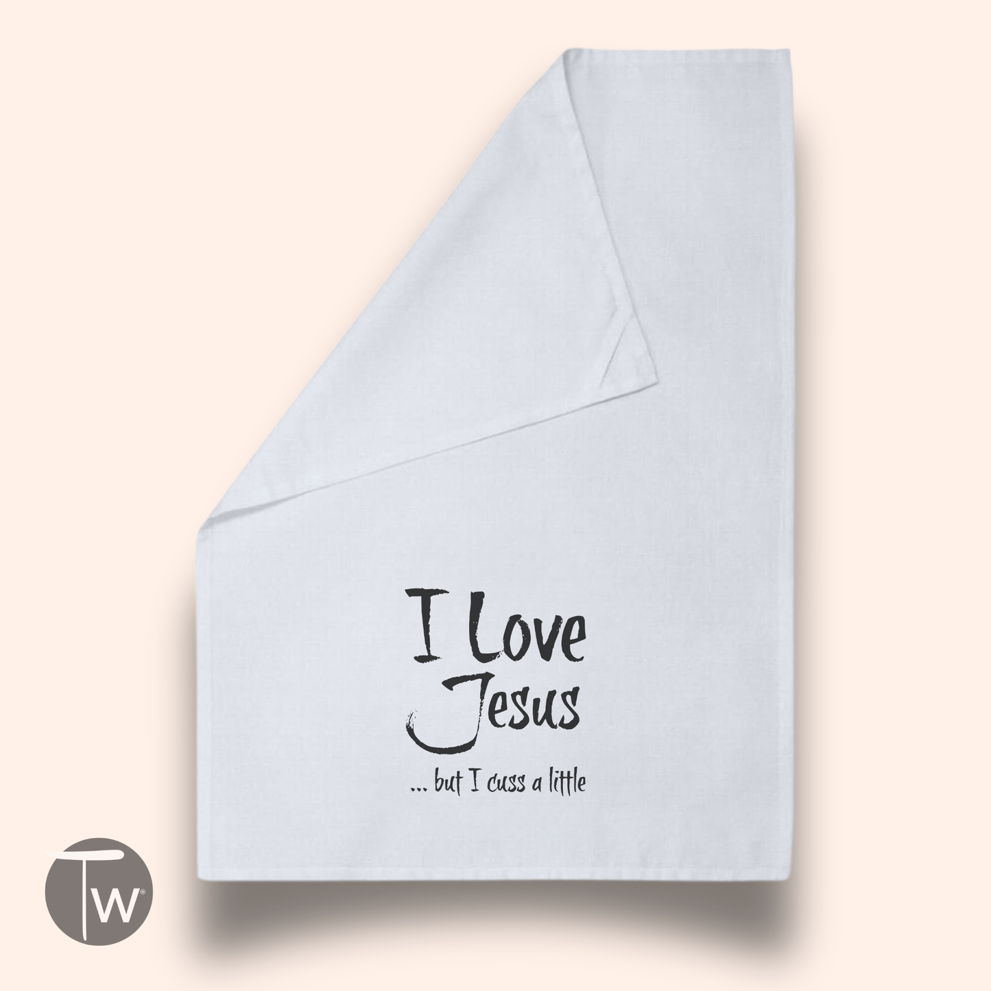 White cotton tea towel featuring the text "I Love Jesus ... but I cuss a little" in black script.