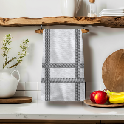 Love You Stripe Illusion towel hanging on a wooden shelf, featuring a white and black striped design with kitchen decor.