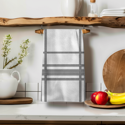 Fkity Fk Illusion Perfect Towel hanging on a wooden shelf, featuring a textured white design with black stripes.