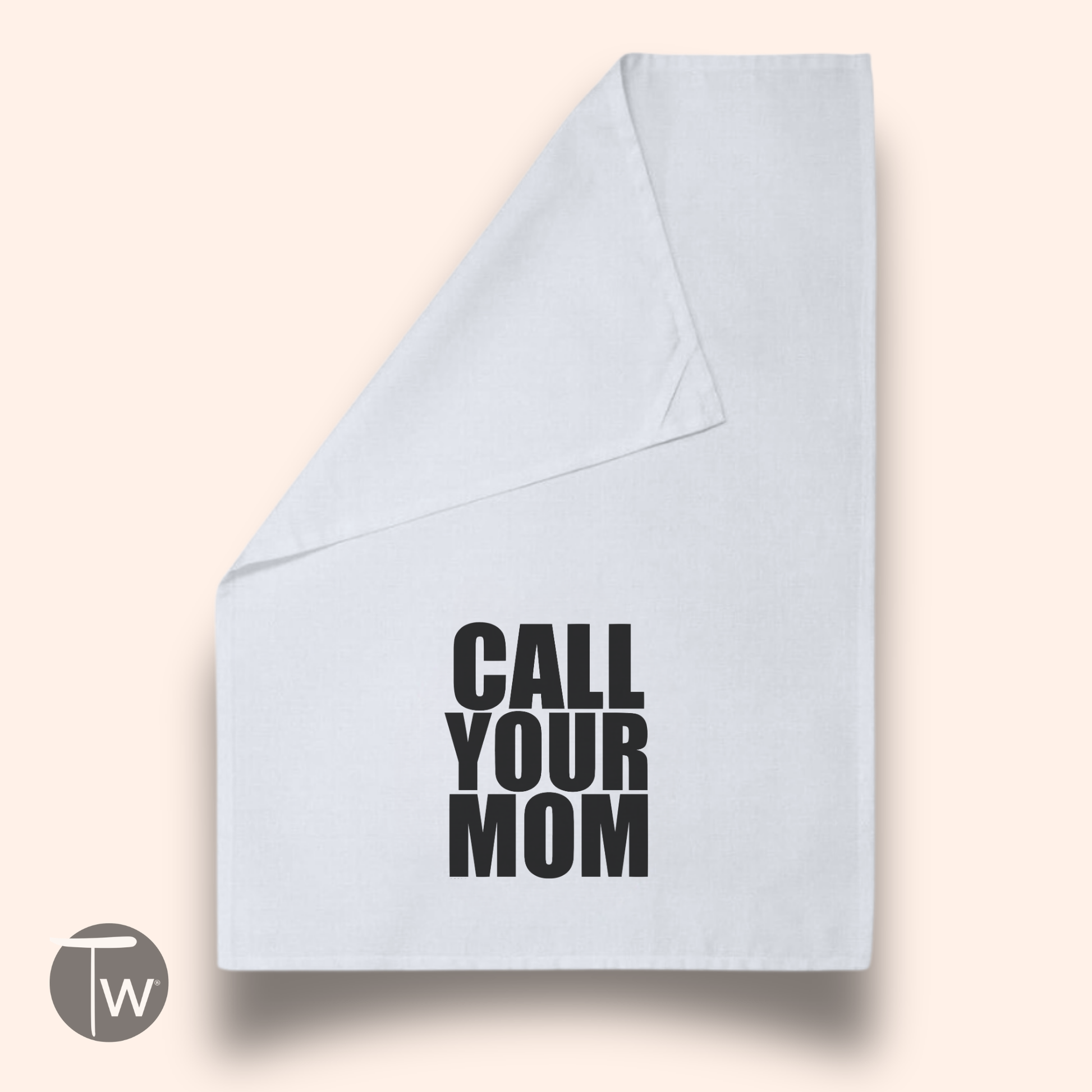 Call Your Mom funny cotton tea towel in white with bold black text, displayed at an angle on a light background.