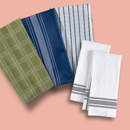 Fresh Out of Fucks Green Illusion Perfect Towel set featuring green, navy, gray, and white towels on a pink background.