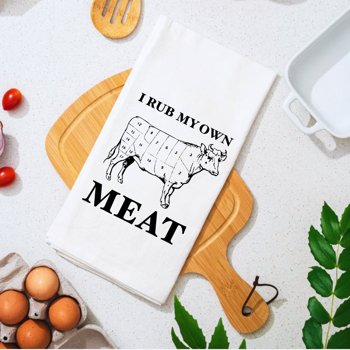 White cotton tea towel featuring a cow illustration and the text "I rub my own meat" in bold black letters.