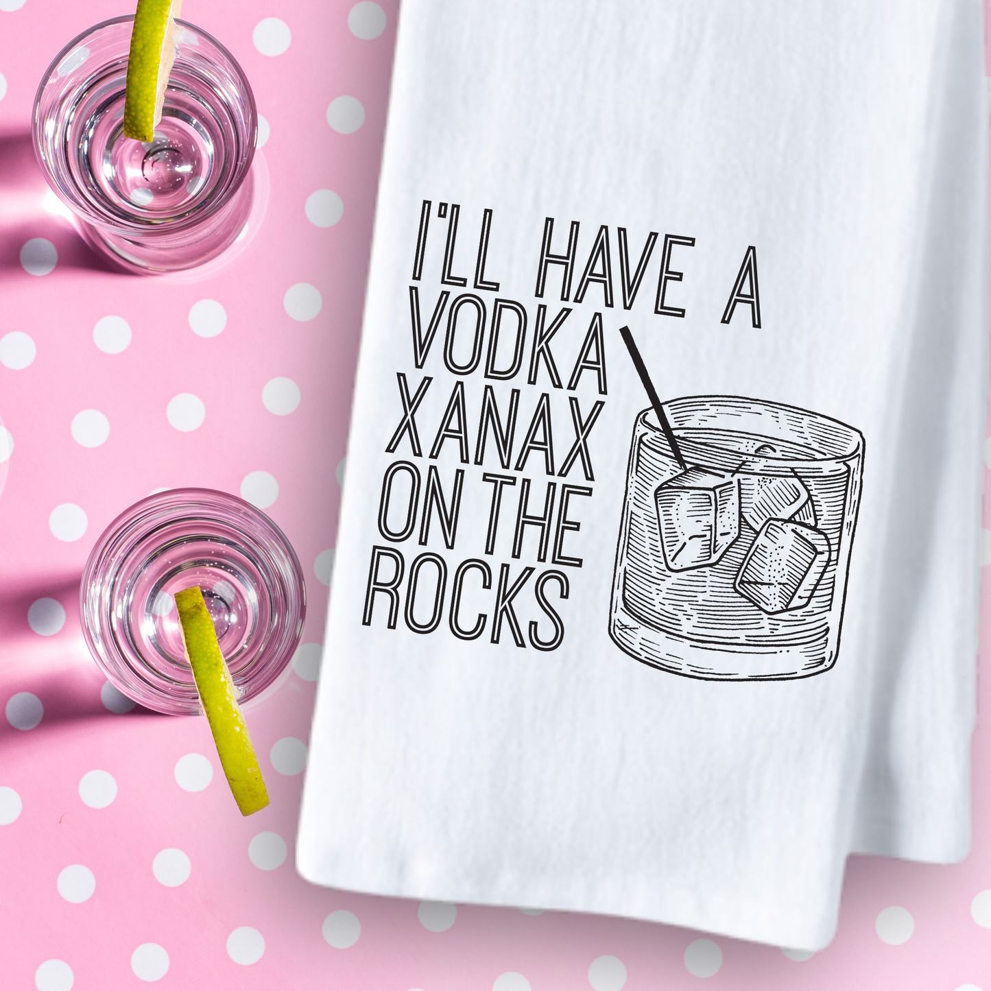 White cotton tea towel featuring the text "I'll have a vodka Xanax on the rocks" with a glass illustration on a pink polka...