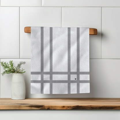 Love You Stripe Illusion towel hanging on a wooden rack, featuring a white background with gray striped pattern.
