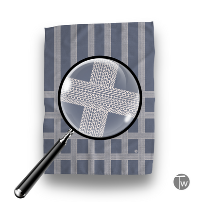Vintage Shitshow Classic Illusion kitchen tea towel with a blue and gray striped pattern and a magnifying glass effect.