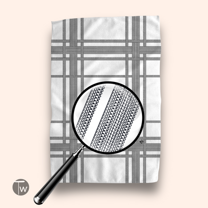 Fkity Fk Illusion Perfect Towel in a white and black plaid pattern, magnified to show detailed texture.