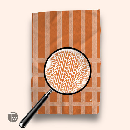 Vintage Shitshow Fall Edition towel featuring an orange and cream striped pattern with text design under a magnifying glass.