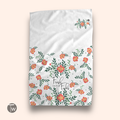 Vintage Fresh Out Perfect Towel with floral design in orange and green on a white background.