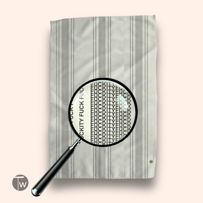 Pardon My French Stripe Illusion towel featuring a striped design in gray and white with text detail under magnification.