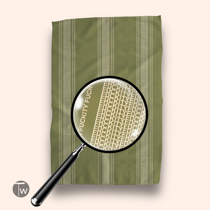 Pardon My French Stripe Fall Illusion towel in olive green with white striped pattern and text detail magnified.