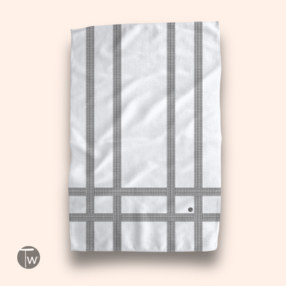 Love You Stripe Illusion towel featuring a white background with gray striped patterns and a small logo in the corner.