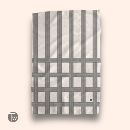 Vintage classic design kitchen tea towel featuring a grid pattern in black and white, displayed against a light background.