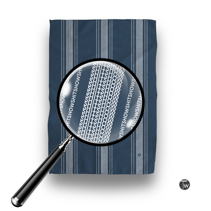 Dark blue Perfect Towel with French stripe design, featuring the word "Shitshow" in a repeating pattern under magnification.
