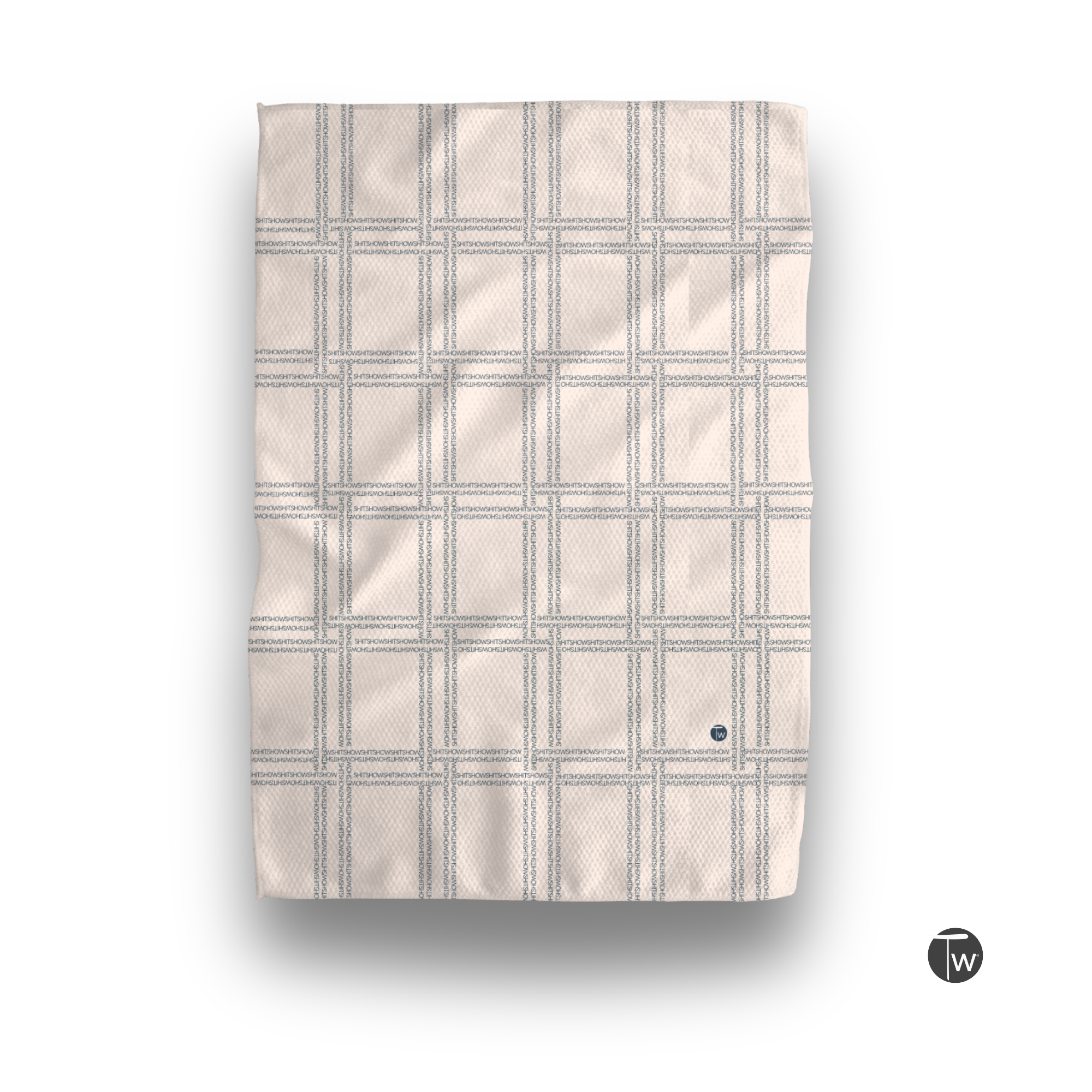 Shitshow plaid towel in retro beige with a textured grid pattern and a small logo in the corner.