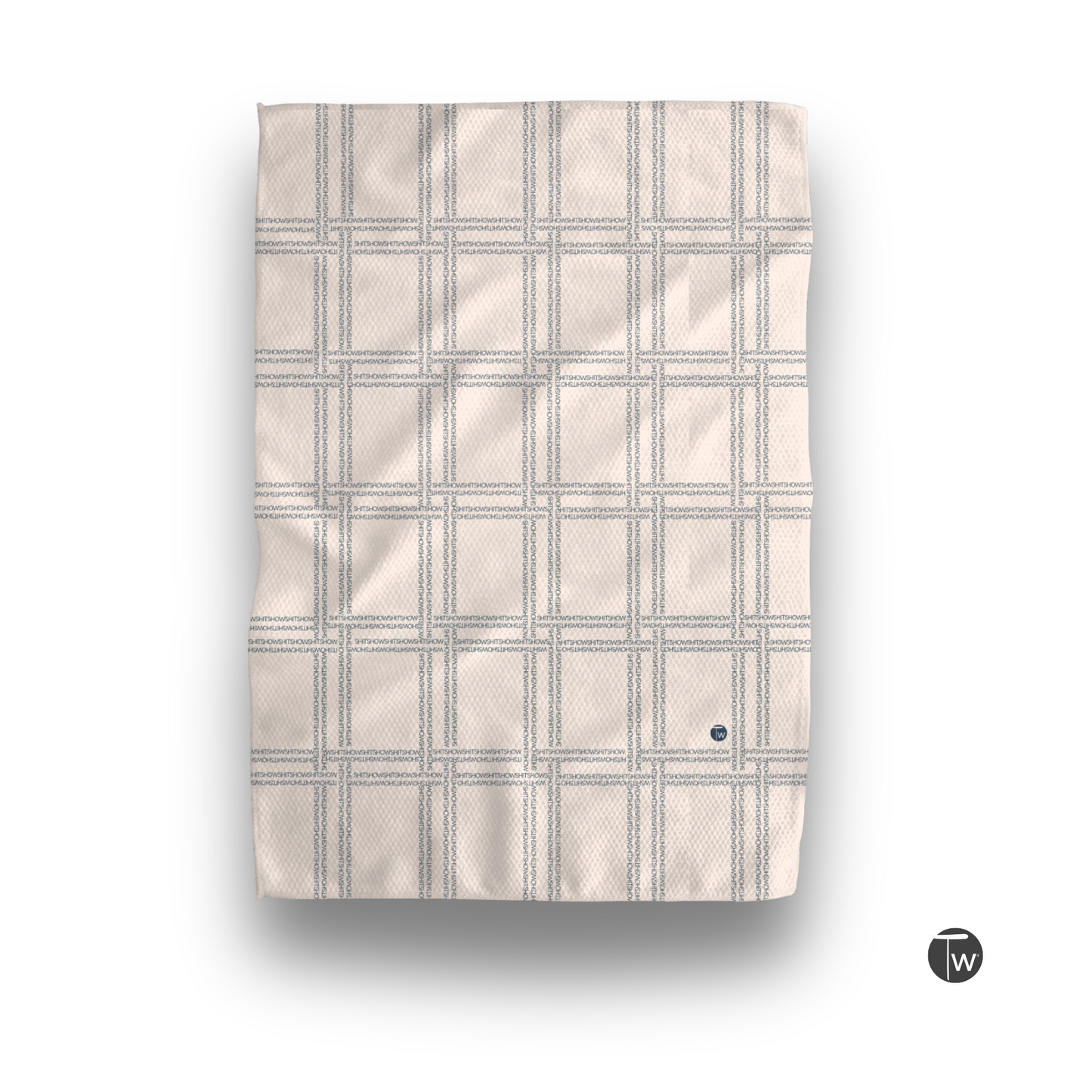 Shitshow plaid towel in retro beige with a textured grid pattern and a small logo in the corner.