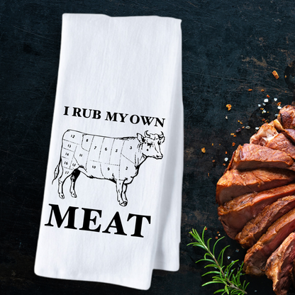 I rub my own meat tea towel featuring a cow diagram and bold text on a white cotton background.