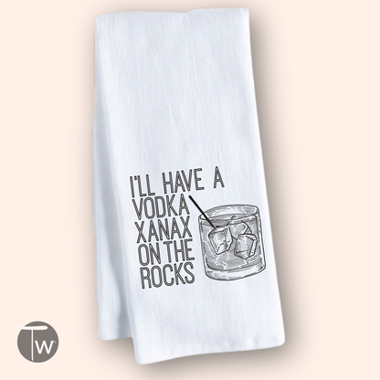 Vodka Xanax on the rocks cotton tea towel featuring a glass with ice and humorous text in black on a white background.